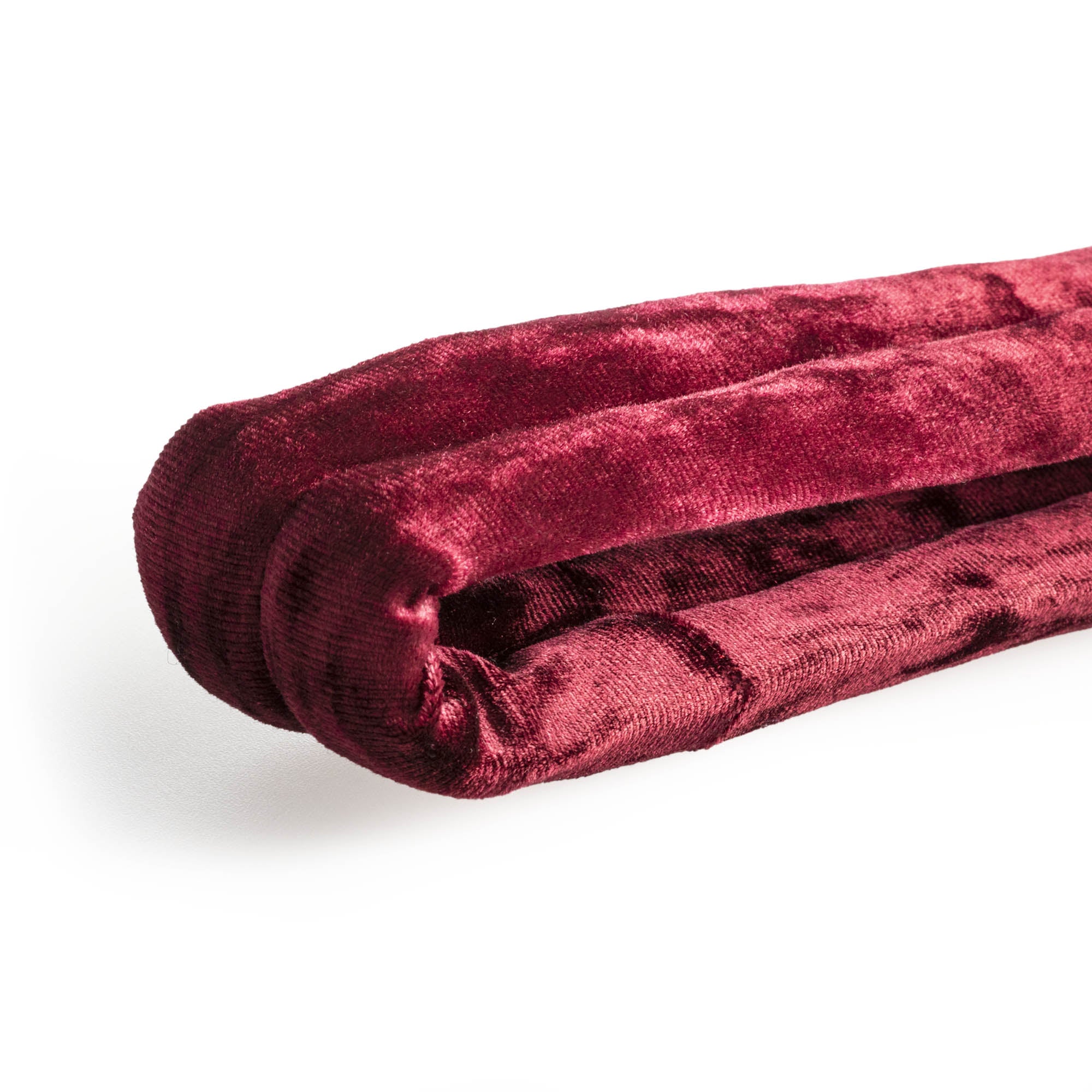 Burgundy velvet hand loop close up texture flat