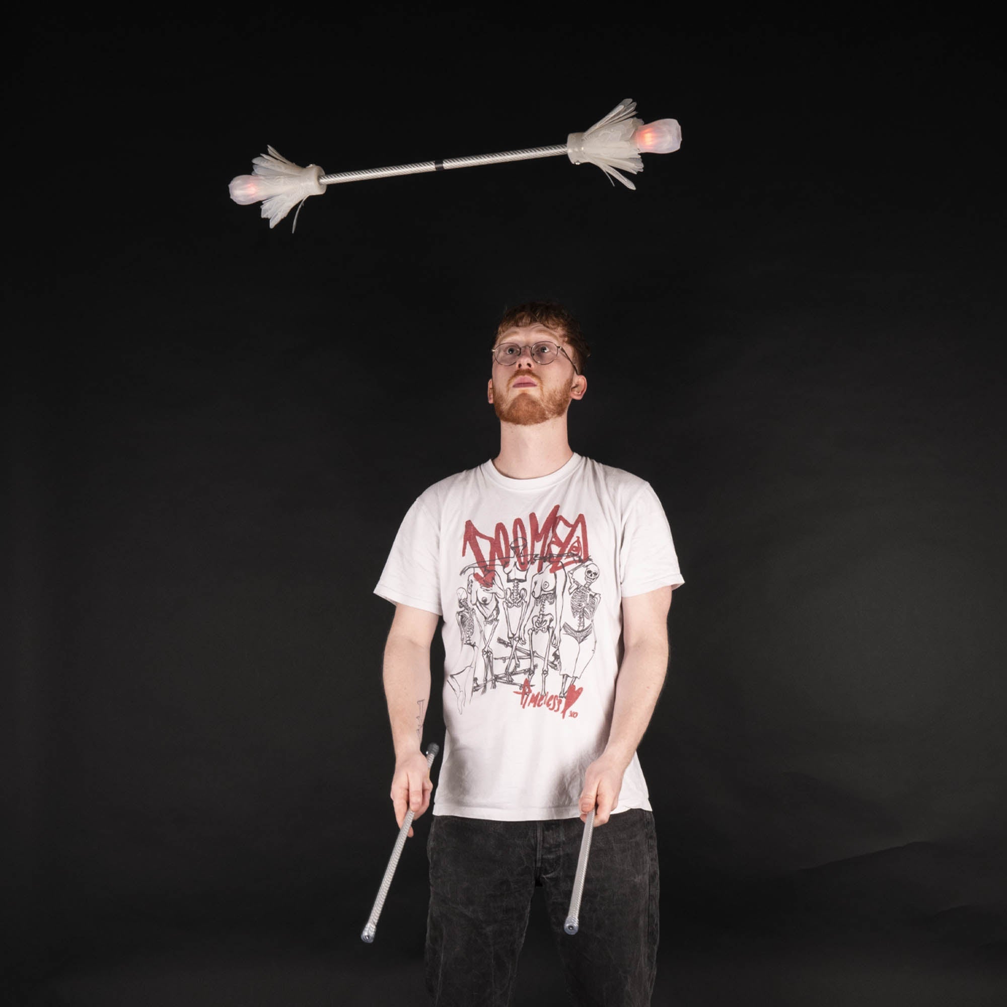 Action shot throwing the flower stick