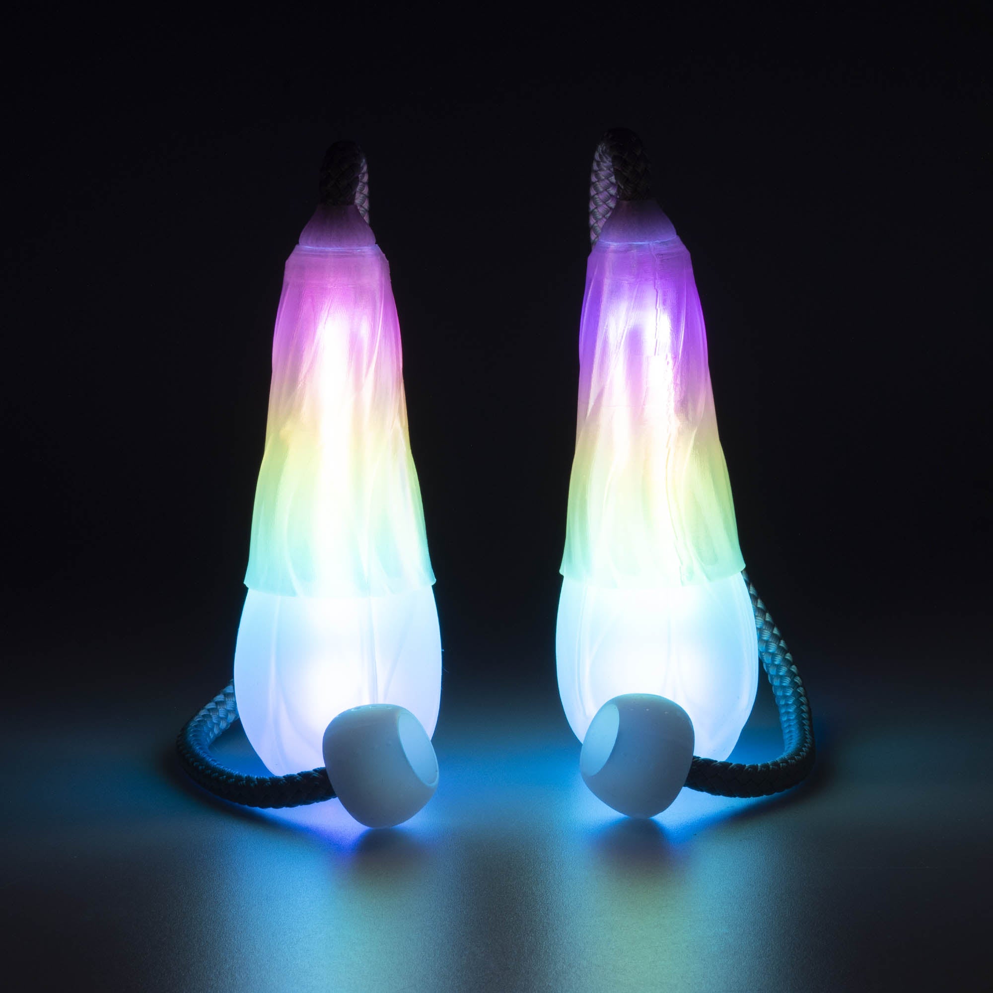 Flowtoys vision spin poi glowing with dark background