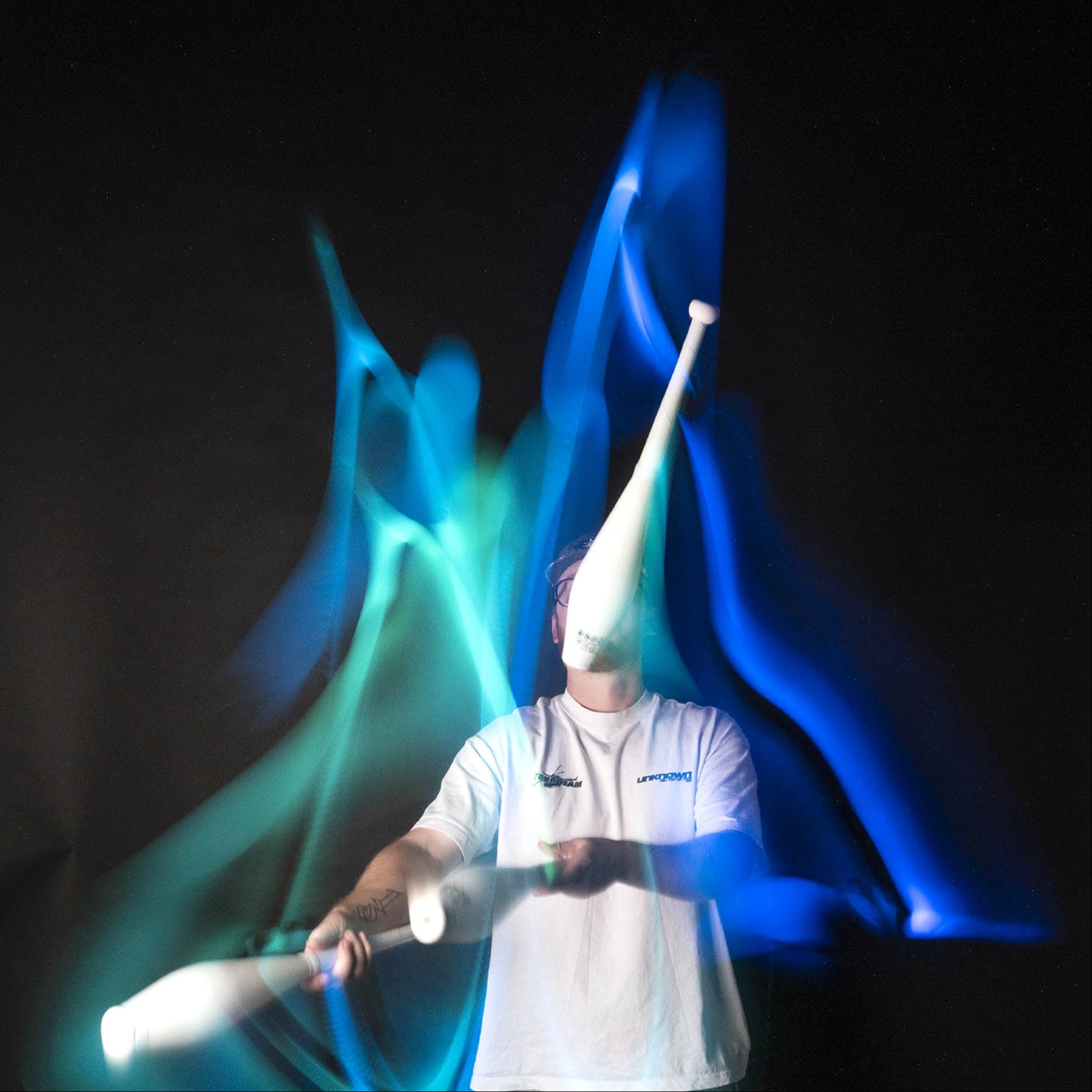 Nebula 3 LED juggling club action shot blue / green glow