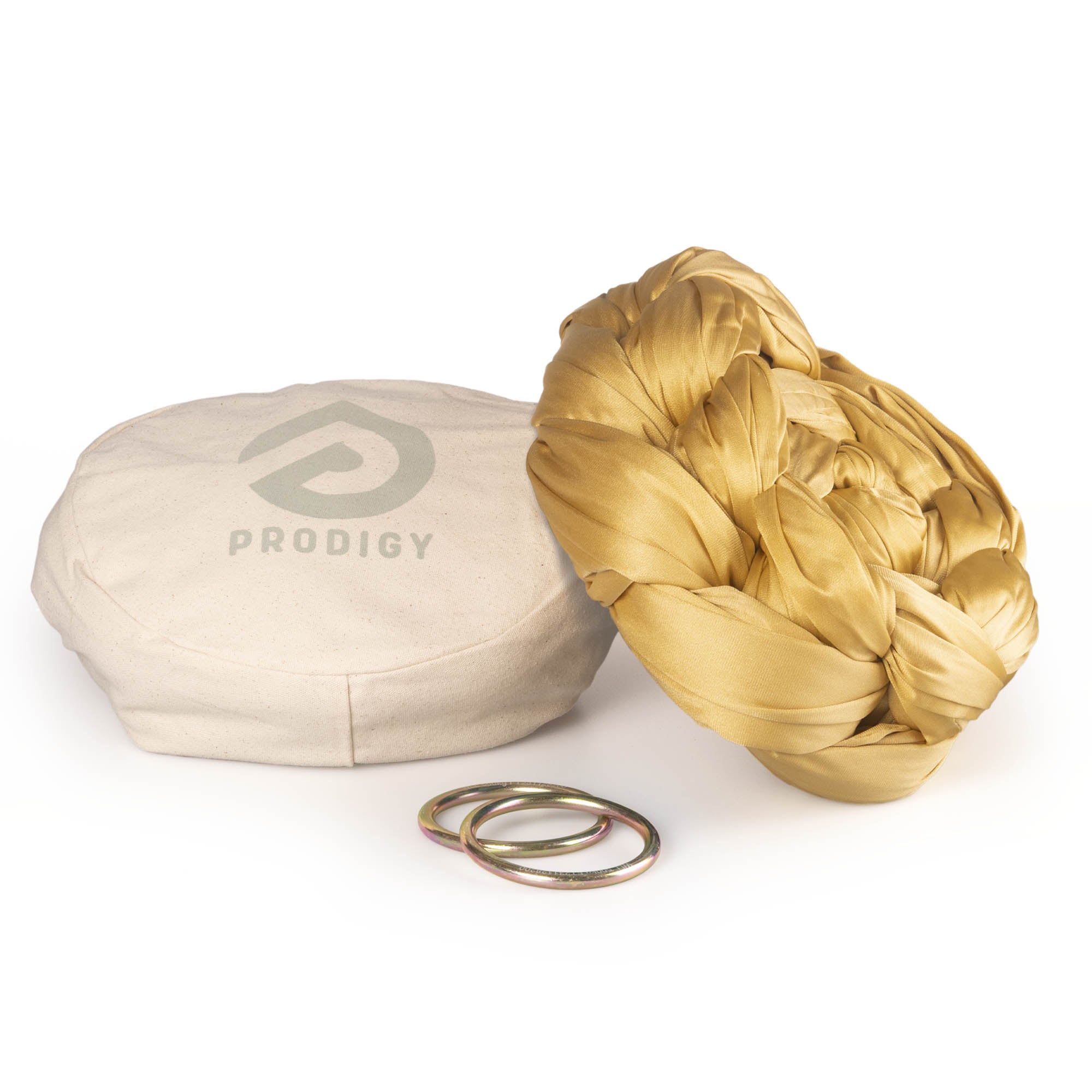 Gold yoga hammock resting on eco bag with O-rings laying in front