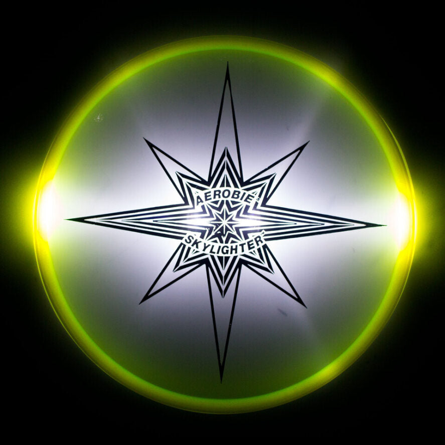 Aerobie skylighter yellow lit on black background