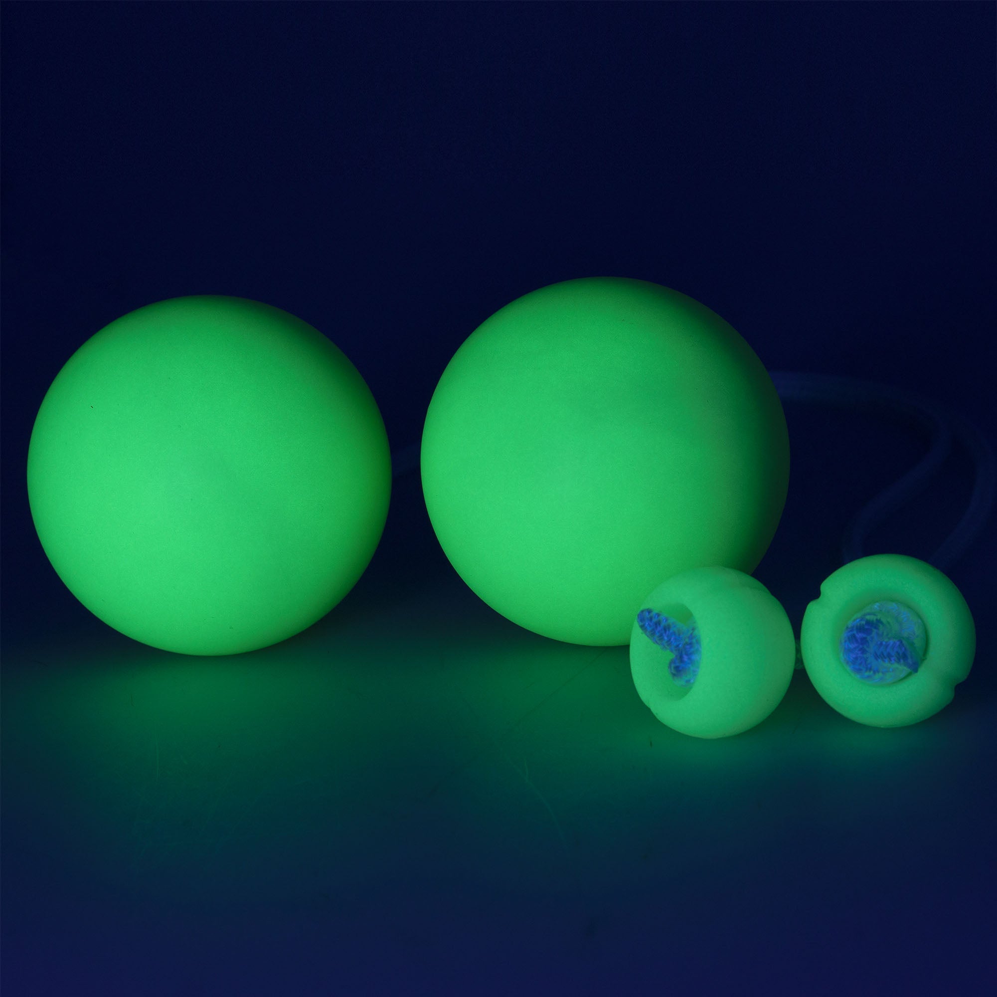 Pair of Dynapro contact poi glowing in the dark