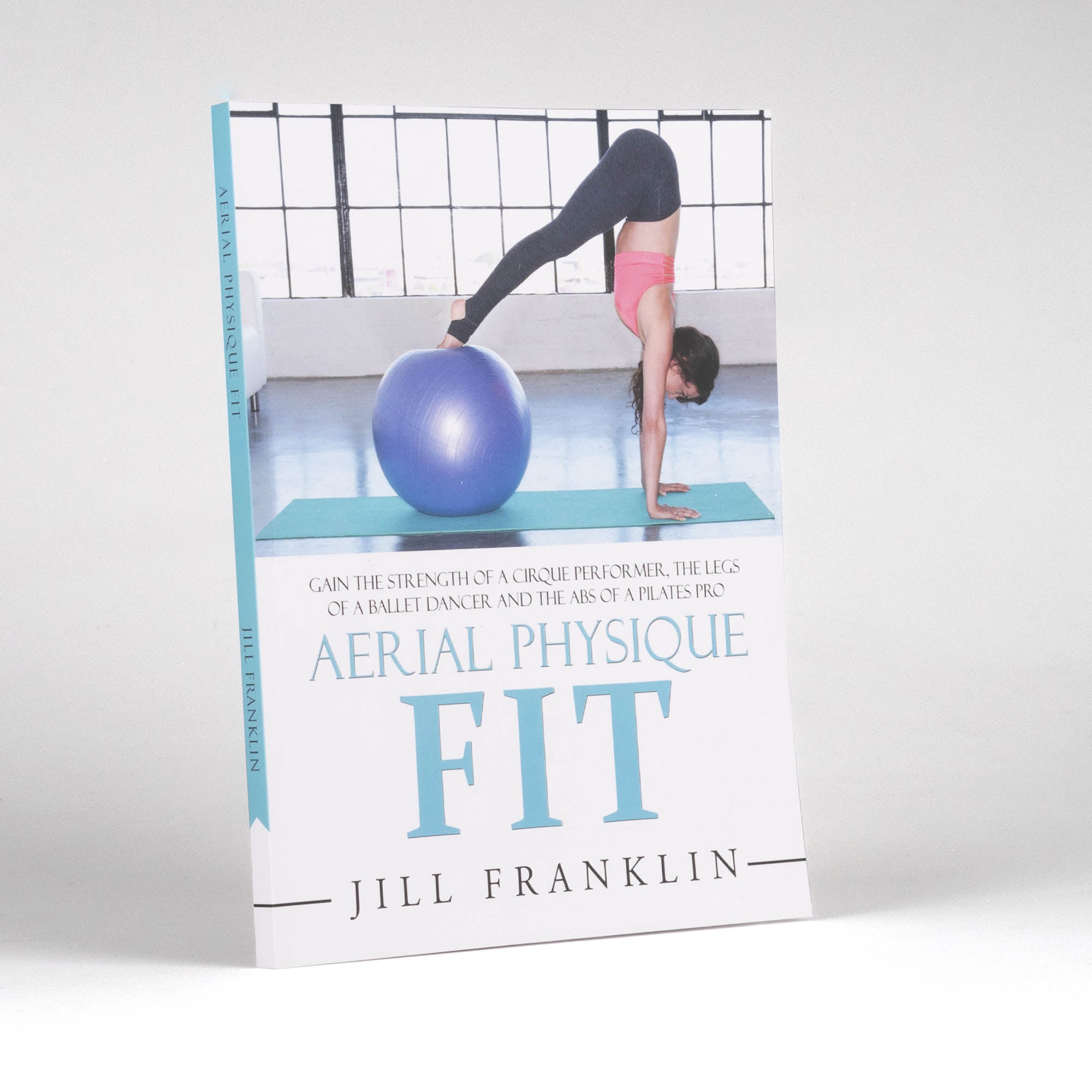 front cover showing the spine of Aerial Physique FIT