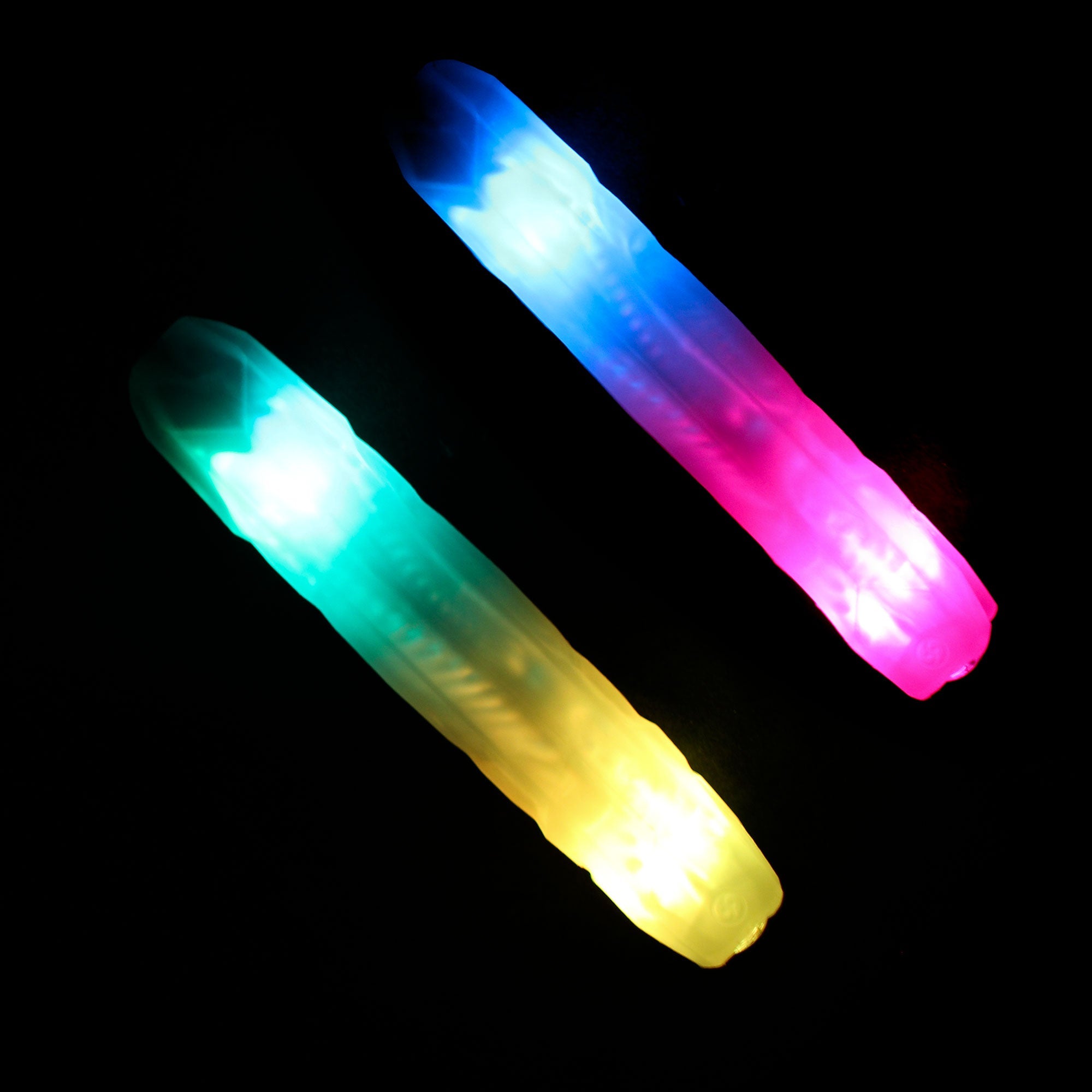 a pair of Crystal Poi Lite glowing, the lights are showing multiple bright colours.