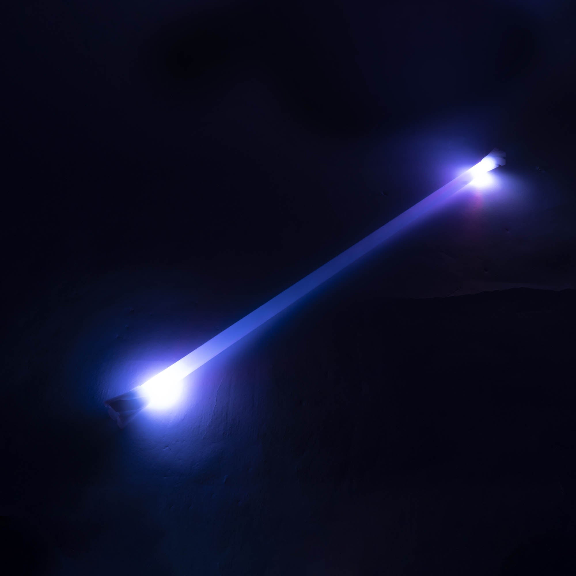 Echo spin staff glowing 100cm with a dark background