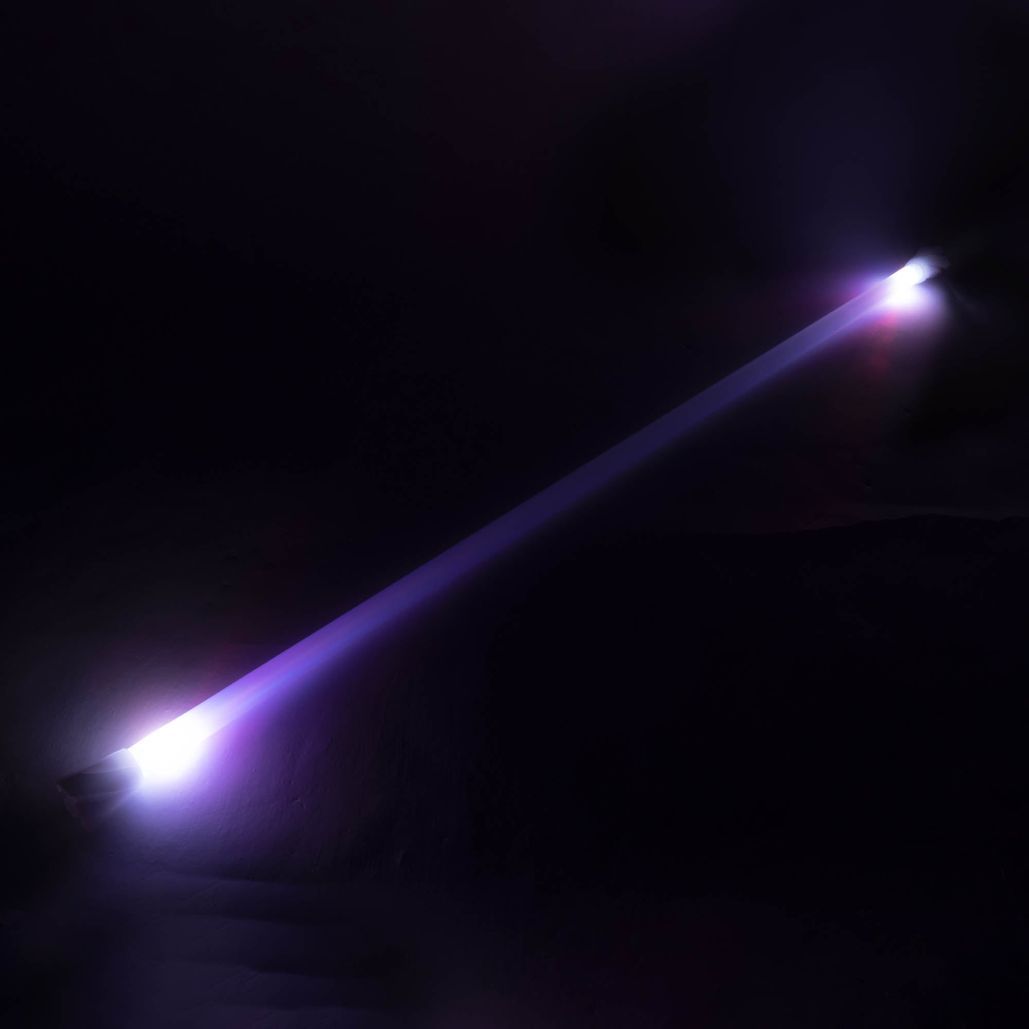 Echo spin staff glowing 120cm with a dark background