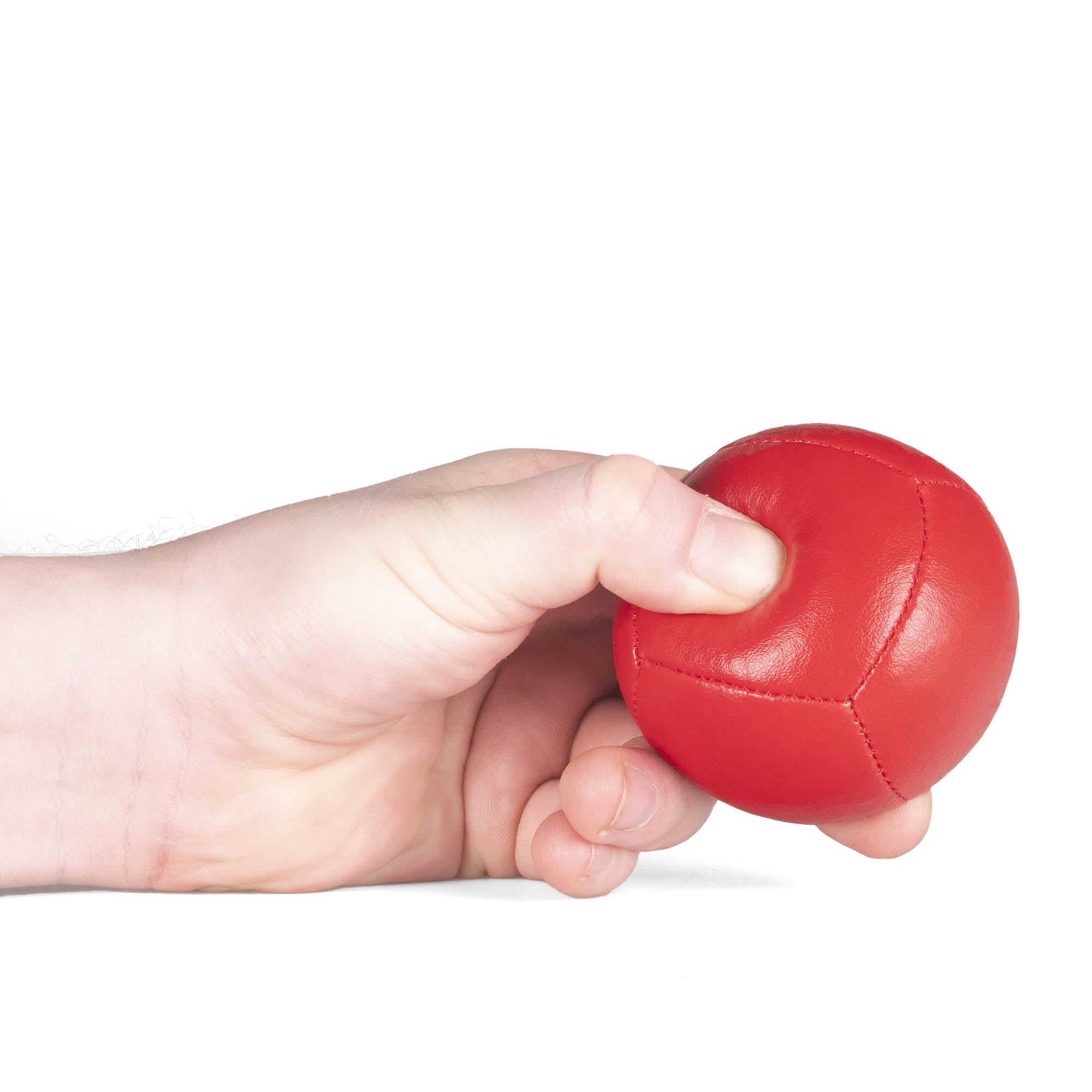 Firetoys red 110g thud juggling ball being squeezed