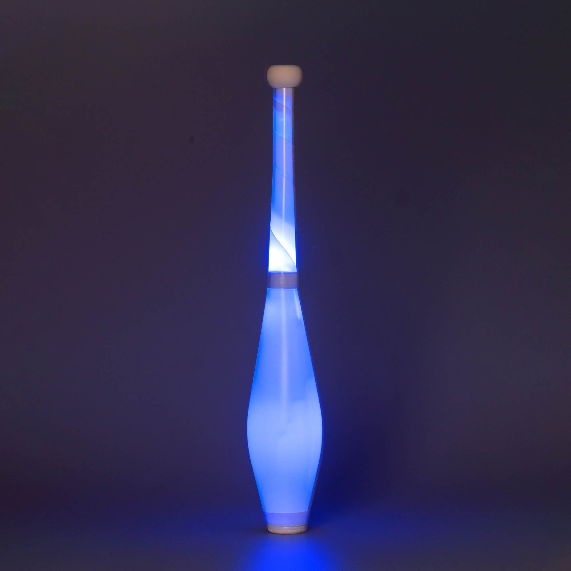 Nebula 3 LED juggling club glowing blue on a dark background