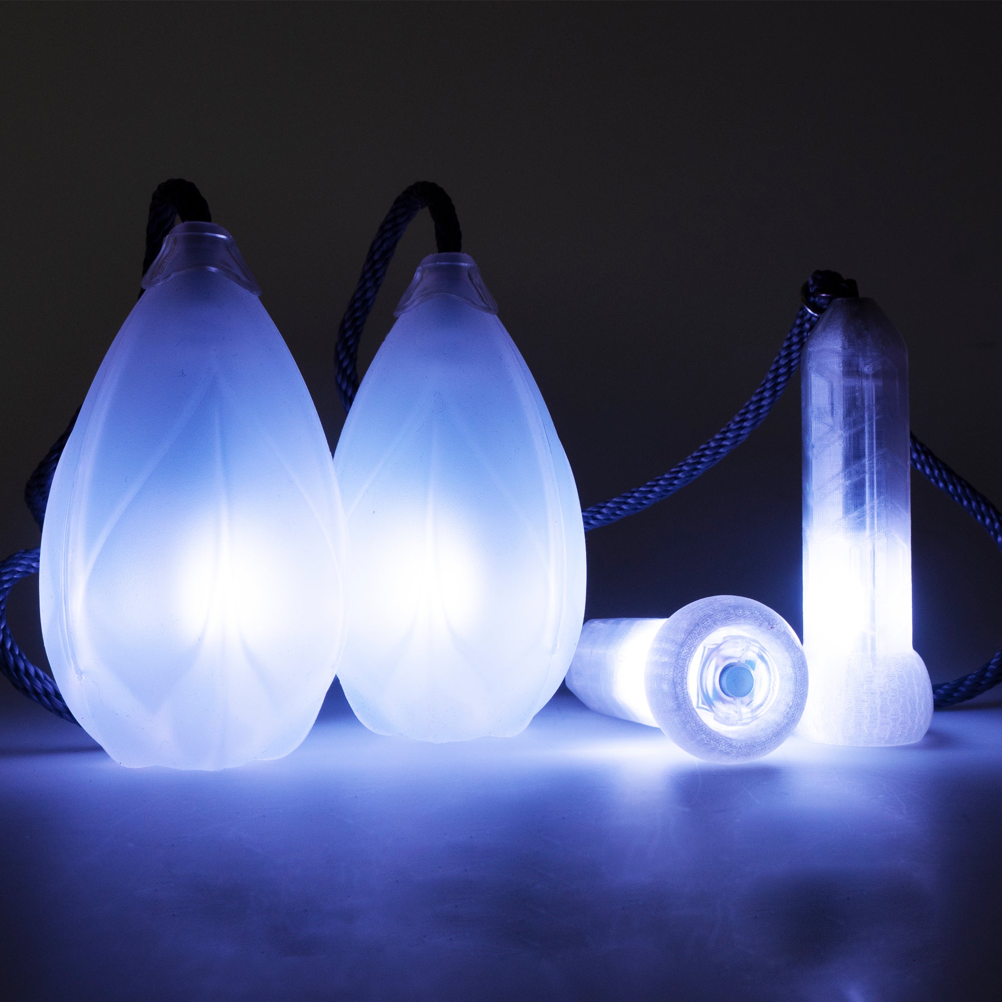 Flowtoys Podpoi v2 with capsule handles, all are glowing white and look bright