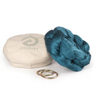 Pine green Aerial Sling resting on eco bag with O-rings laying in front