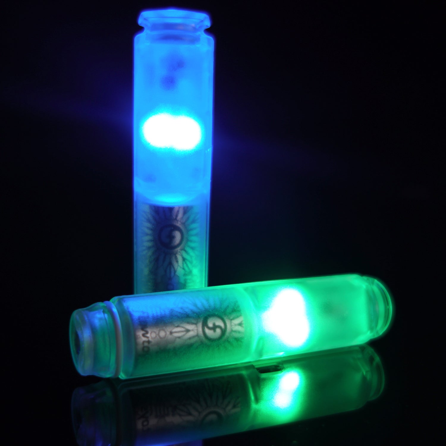 Two capsules lit up with dark background
