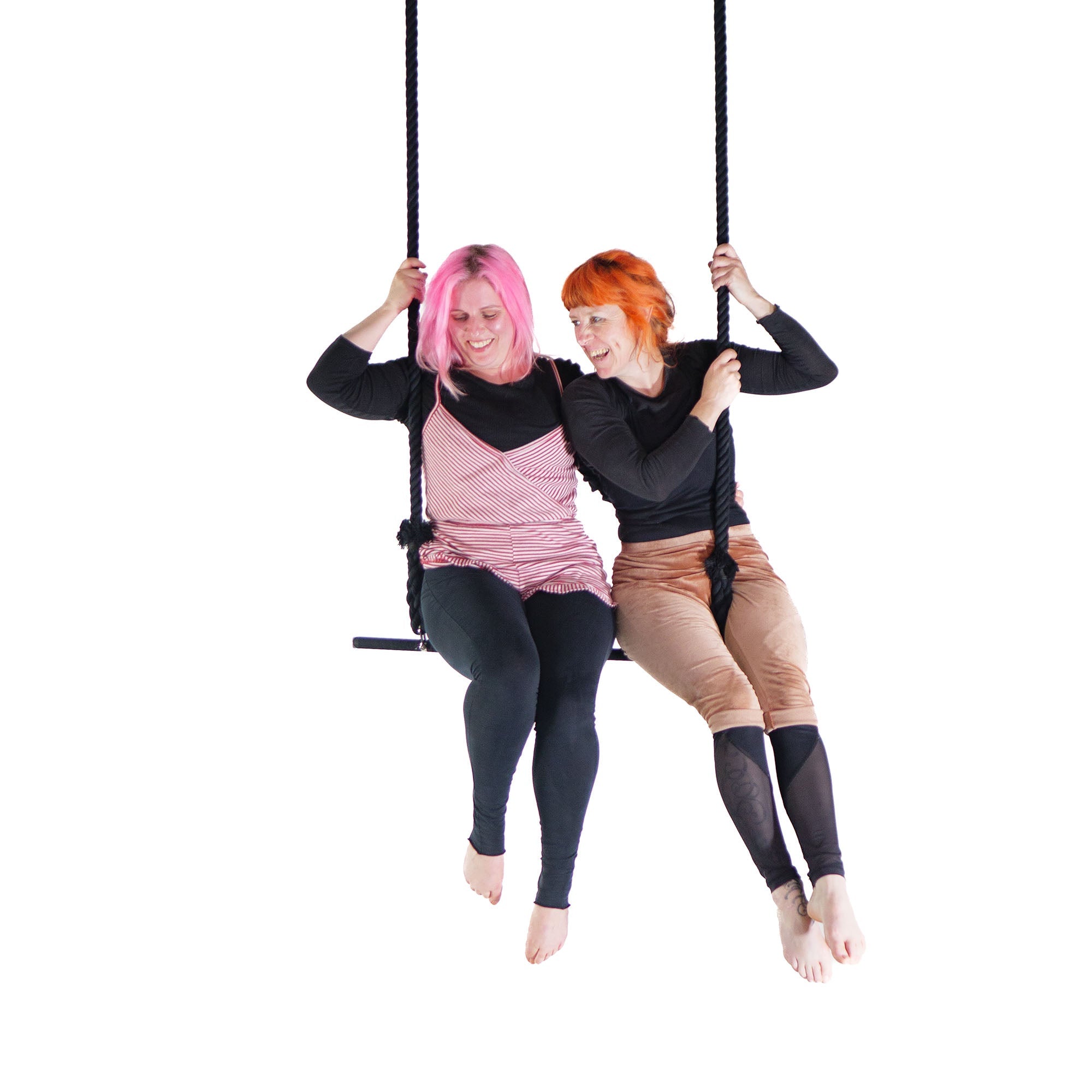performers sitting on trapeze
