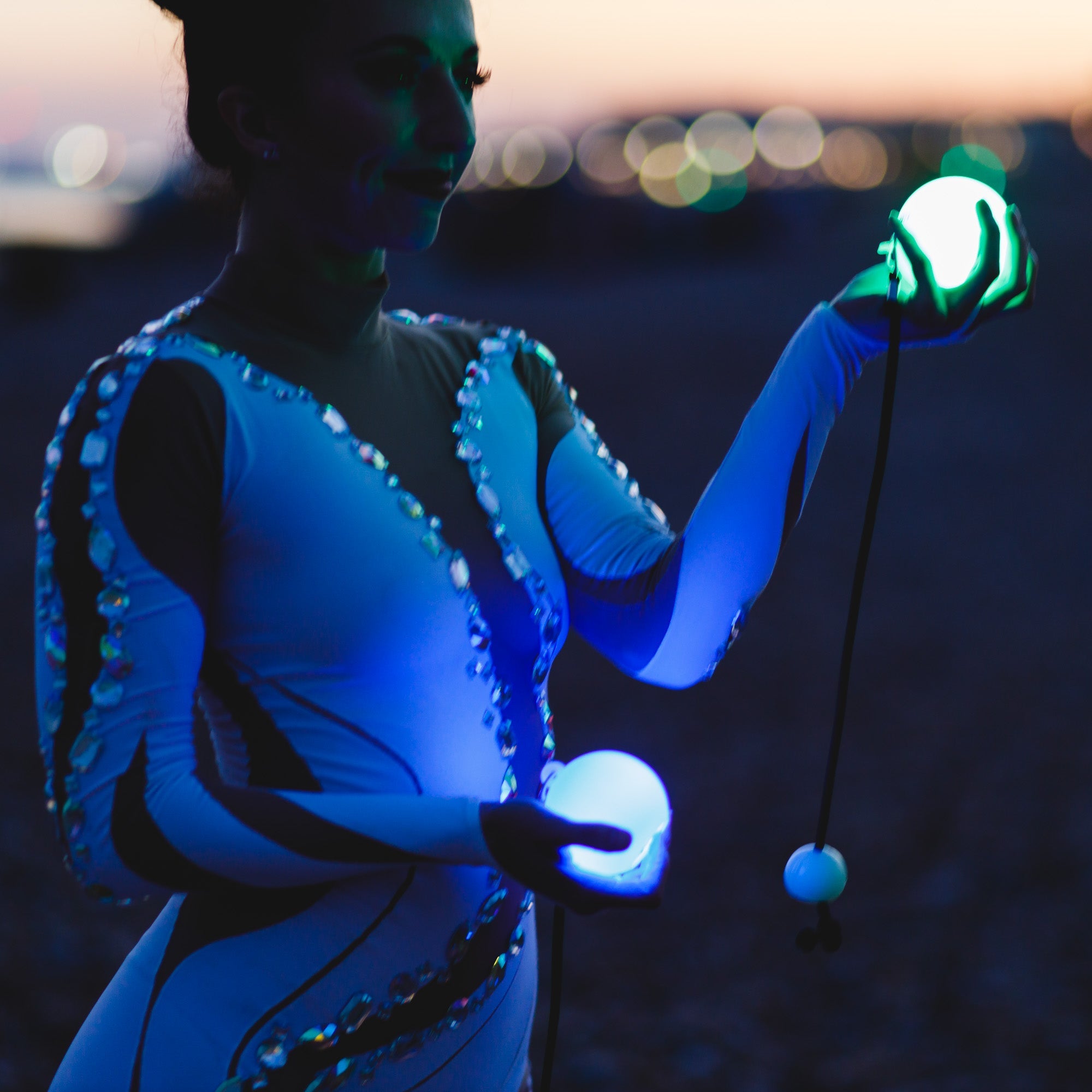 performer with glow poi glowing
