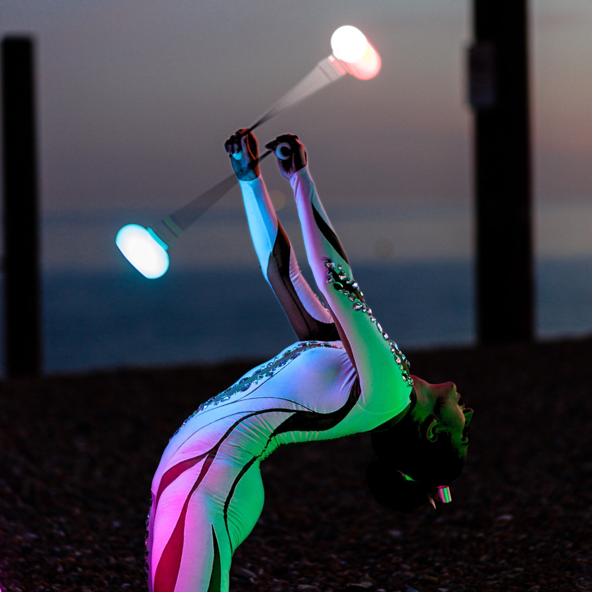 a performer spinning glow poi