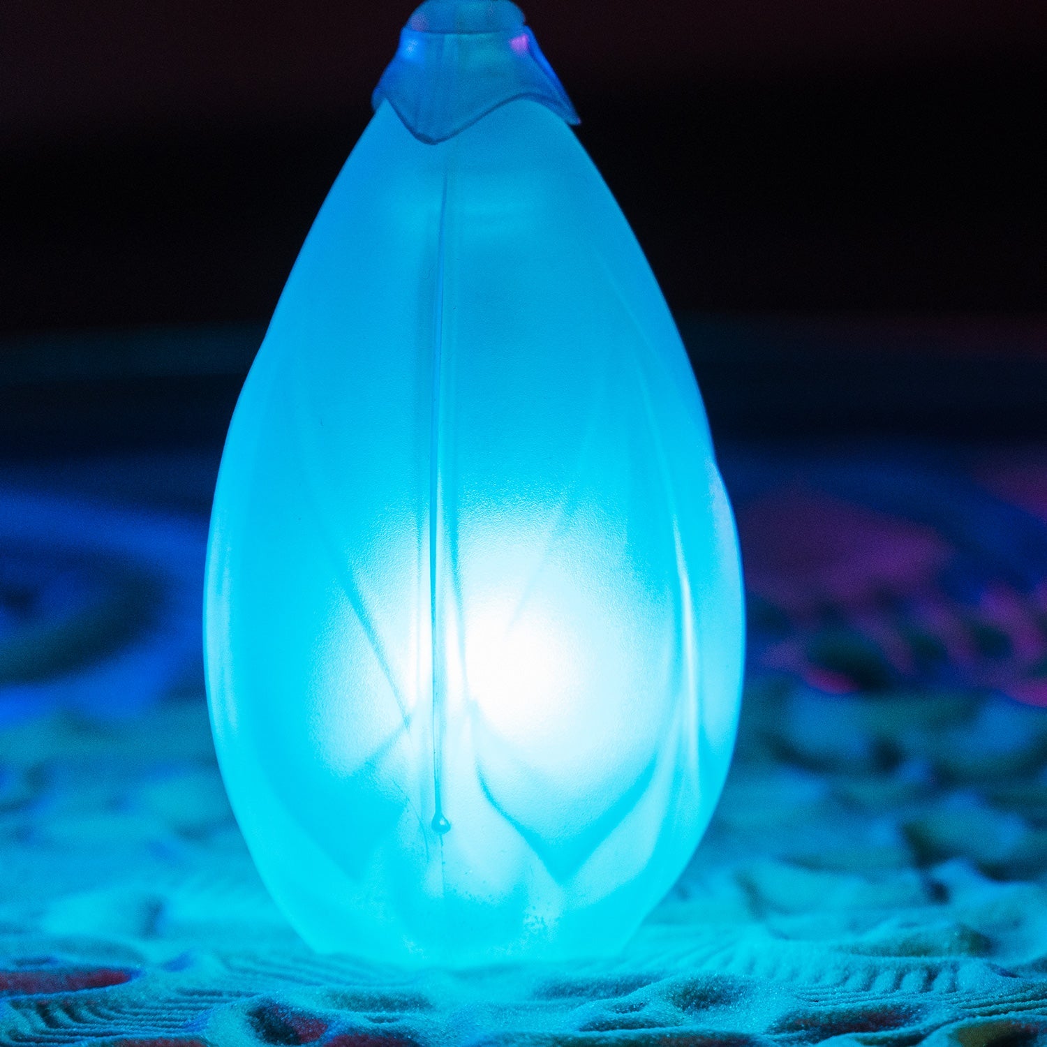 close up of single Flowtoys Podpoi v2 glowing