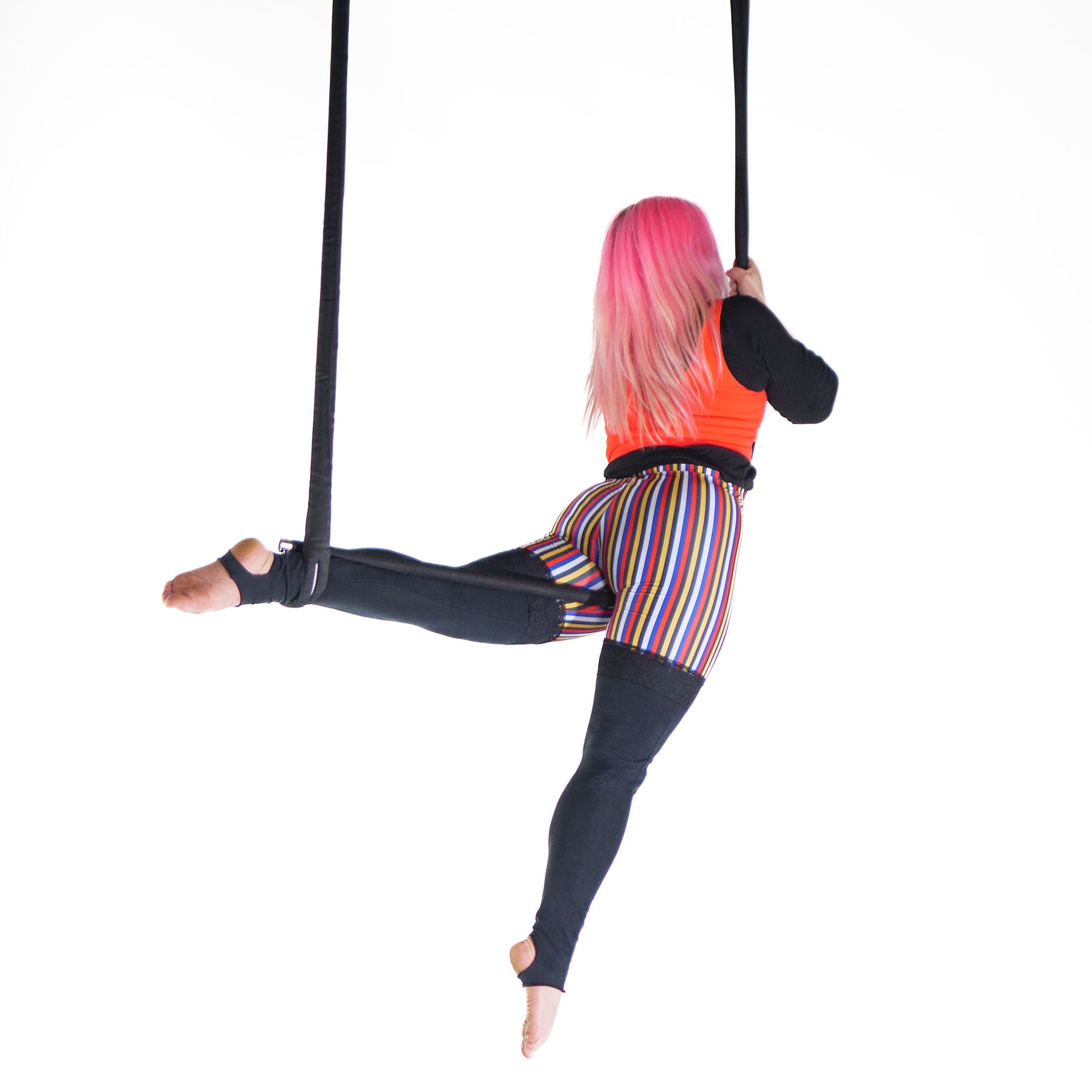 performer on shackle trapeze