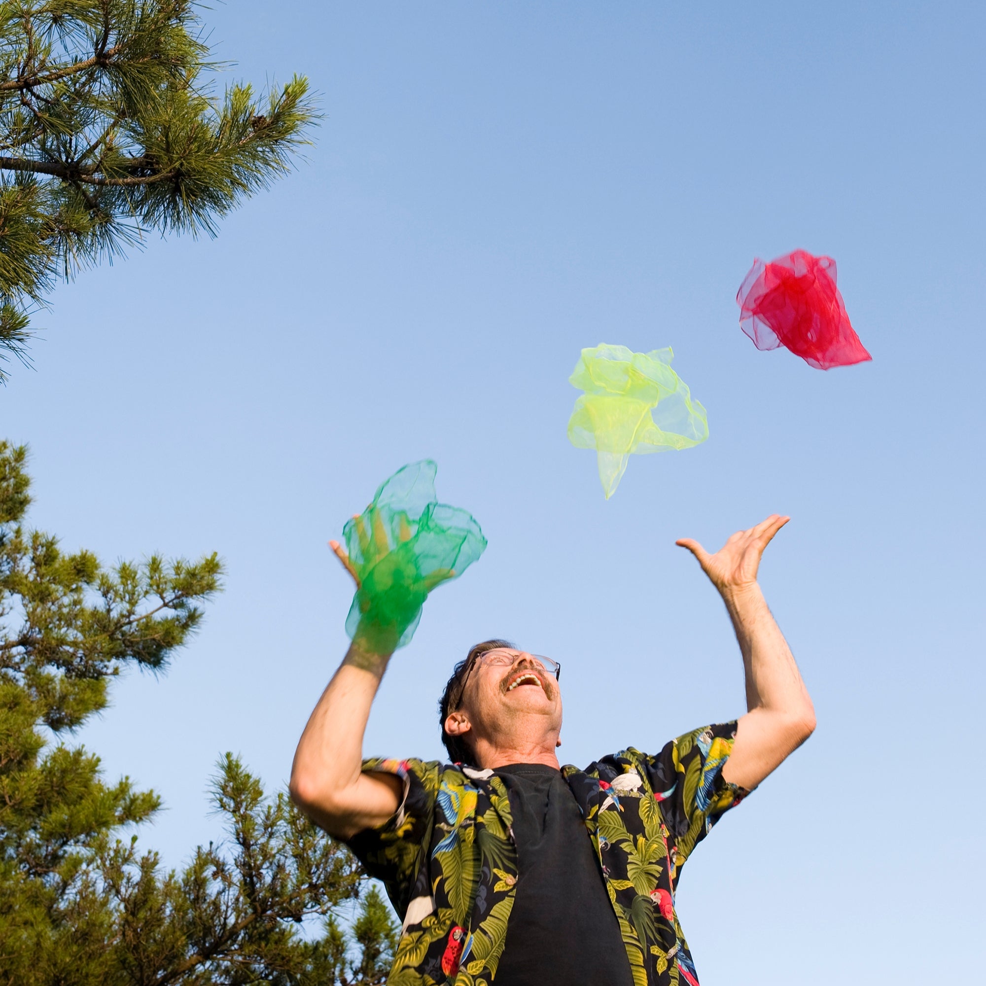 performer juggling outside