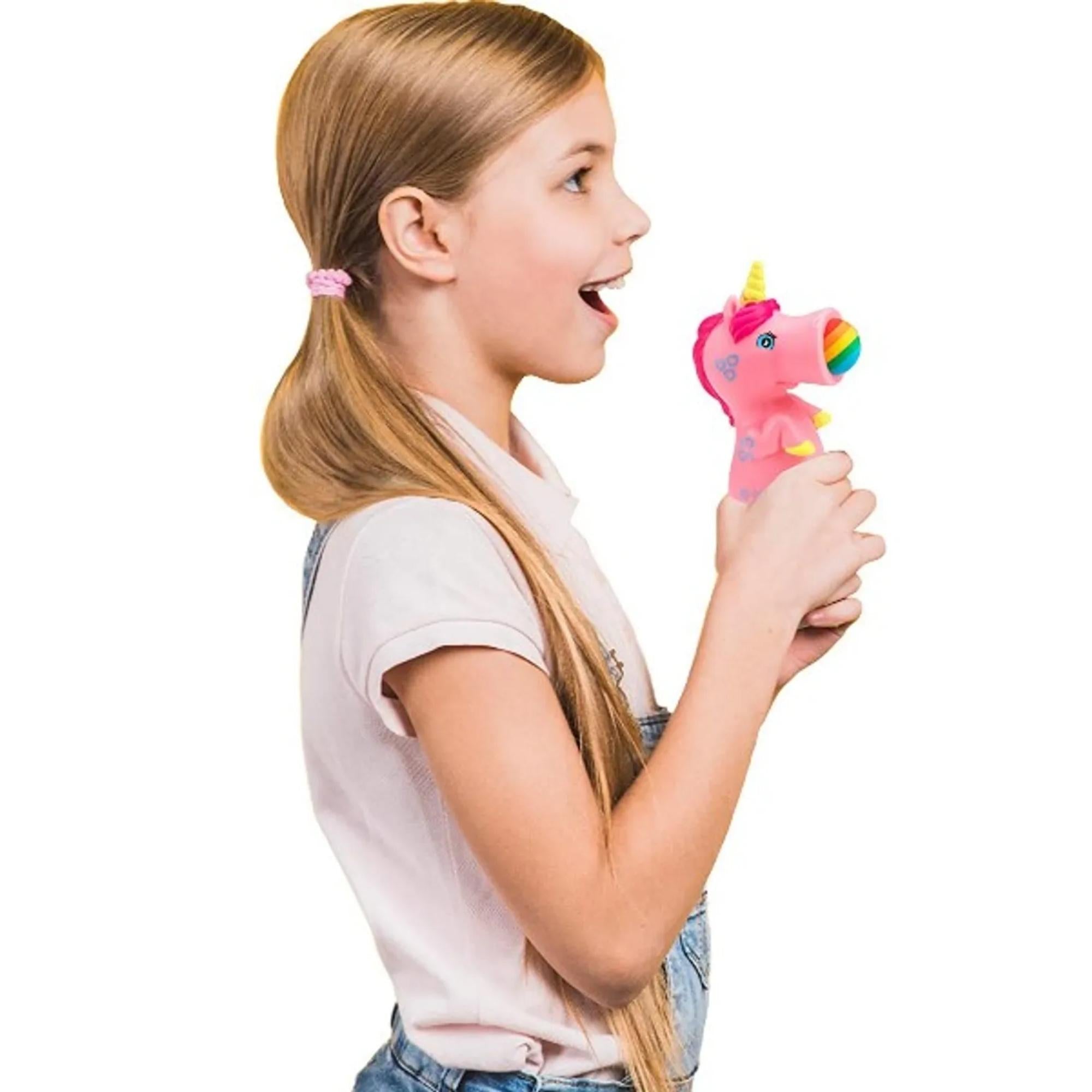 squeeze popper pink unicorn being held
