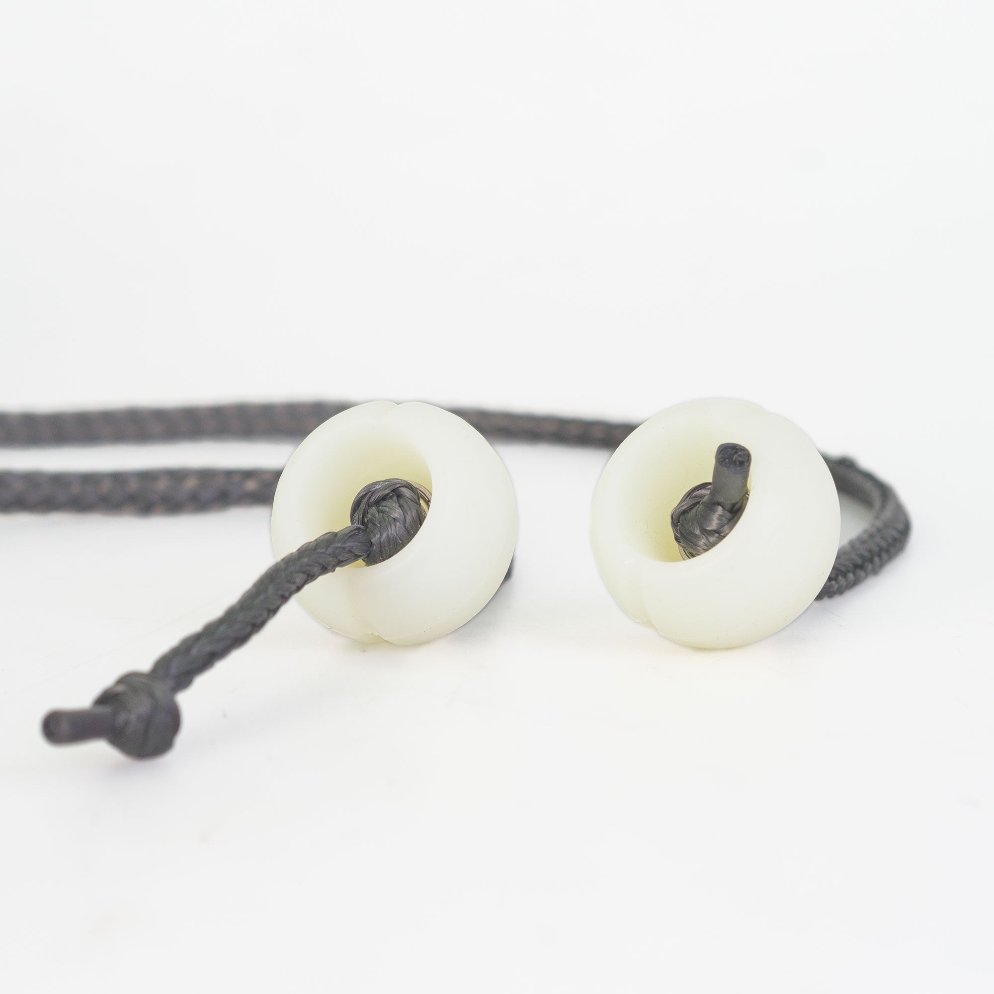 Close up of Silicone poi handles attached to cord